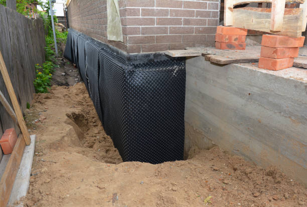 SJ Waterproofing Pros technician performing targeted Basement Waterproofing assessment in Clearwater, MN